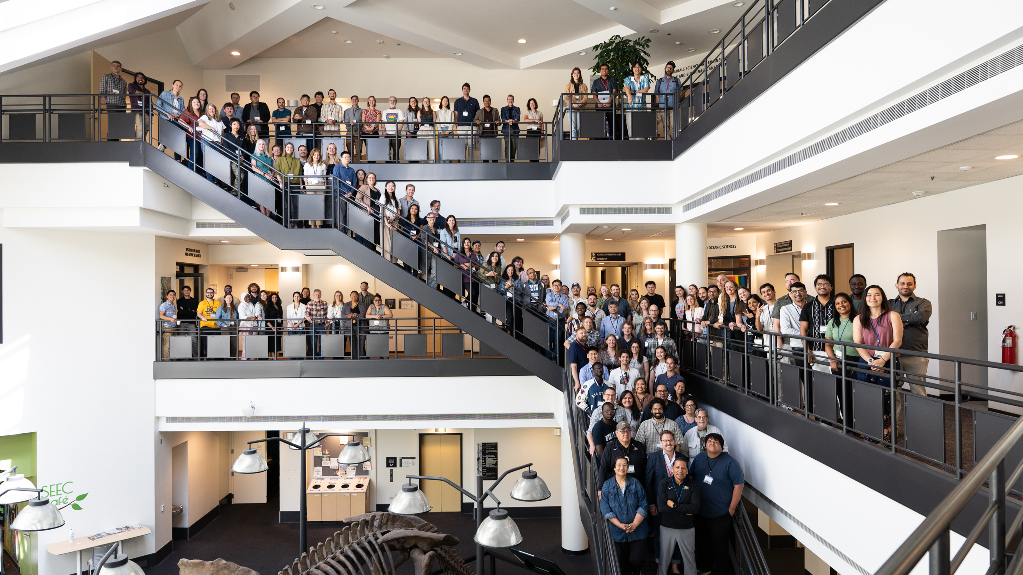 Participants of the fourth annual ESIIL AI for Sustainability Summit gathered on the staircase of the SEEC atrium at the University of Colorado Boulder
